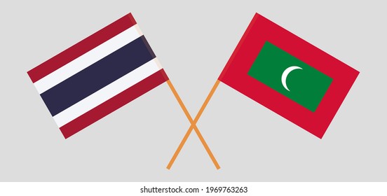 Crossed flags of Thailand and Maldives. Official colors. Correct proportion