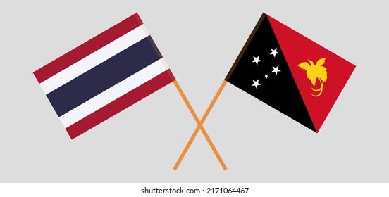 Crossed flags of Thailand and Papua New Guinea. Official colors. Correct proportion. Vector illustration
