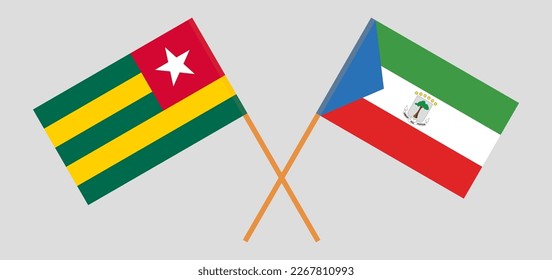 Crossed flags of Togo and Equatorial Guinea. Official colors. Correct proportion. Vector illustration
