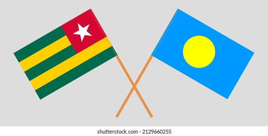 Crossed flags of Togo and Palau. Official colors. Correct proportion. Vector illustration
