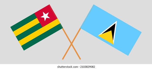 Crossed flags of Togo and Saint Lucia. Official colors. Correct proportion. Vector illustration
