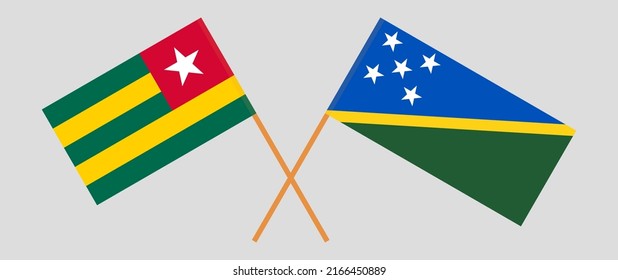 Crossed flags of Togo and Solomon Islands. Official colors. Correct proportion. Vector illustration
