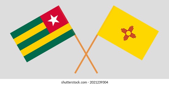 Crossed flags of Togo and the State of New Mexico. Official colors. Correct proportion.