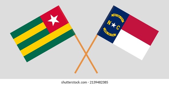 Crossed flags of Togo and The State of North Carolina. Official colors. Correct proportion. Vector illustration
