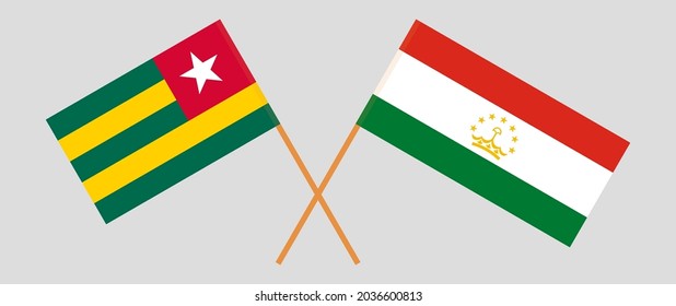 Crossed flags of Togo and Tajikistan. Official colors. Correct proportion