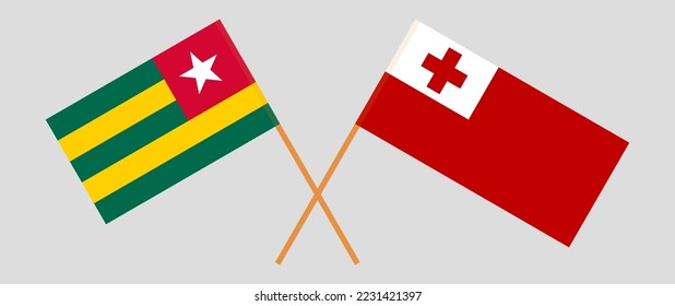 Crossed flags of Togo and Tonga. Official colors. Correct proportion. Vector illustration
