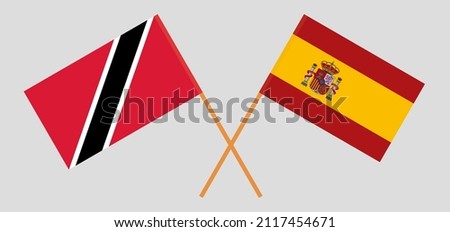 Crossed flags of Trinidad and Tobago and Spain. Official colors. Correct proportion. Vector illustration
