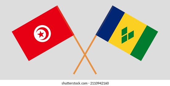 Crossed flags of Tunisia and Saint Vincent and the Grenadines. Official colors. Correct proportion. Vector illustration