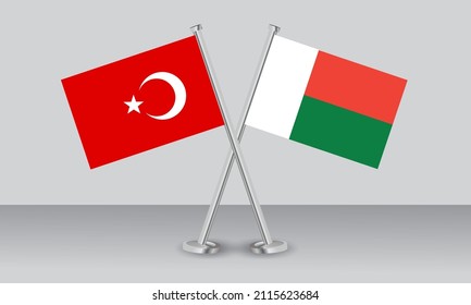 Crossed flags of Türkiye (Turkey) and Madagascar. Official colors. Correct proportion. Banner design