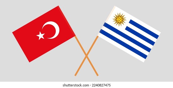 Crossed flags of Turkiye and Uruguay. Official colors. Correct proportion. Vector illustration
