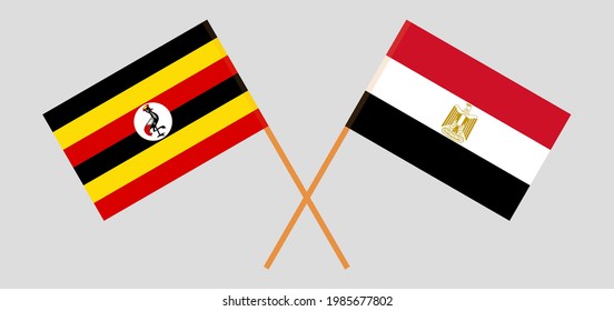 Banderas cruzadas de Uganda y Egipto. Colores oficiales. Proporción correcta