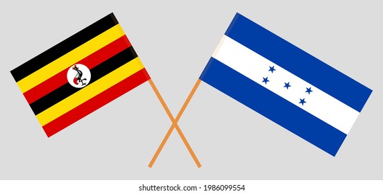 Crossed flags of Uganda and Honduras. Official colors. Correct proportion