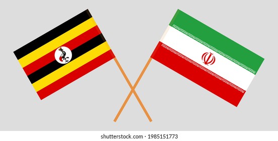 Crossed flags of Uganda and Iran. Official colors. Correct proportion