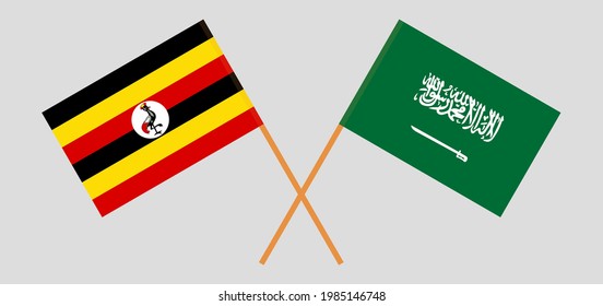 Banderas cruzadas de Uganda y el Reino de Arabia Saudita. Colores oficiales. Proporción correcta
