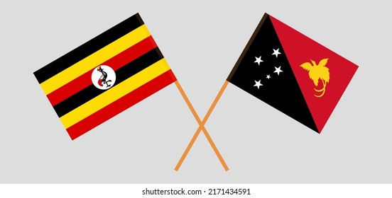 Crossed flags of Uganda and Papua New Guinea. Official colors. Correct proportion. Vector illustration
