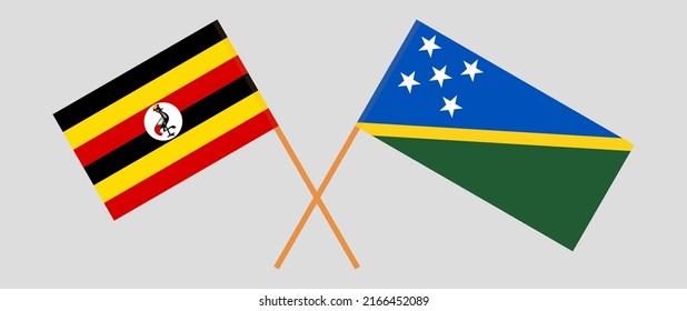 Crossed flags of Uganda and Solomon Islands. Official colors. Correct proportion. Vector illustration
