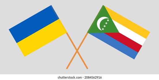 Banderas cruzadas de Ucrania y las Comoras. Colores oficiales. Proporción correcta. Ilustración del vector
