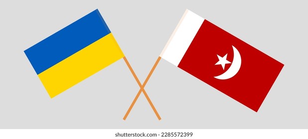Crossed flags of Ukraine and The Emirate of Umm Al Quwain. Official colors. Correct proportion. Vector illustration
