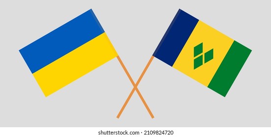 Crossed flags of Ukraine and Saint Vincent and the Grenadines. Official colors. Correct proportion. Vector illustration
