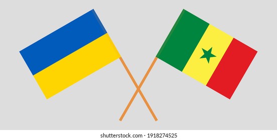 Crossed flags of Ukraine and Senegal