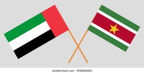 Crossed flags of the United Arab Emirates and Suriname. Official colors. Correct proportion