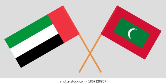 Crossed flags of the United Arab Emirates and Maldives. Official colors. Correct proportion