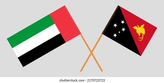 Crossed flags of the United Arab Emirates and Papua New Guinea. Official colors. Correct proportion. Vector illustration

