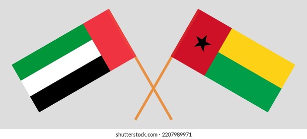 Crossed flags of the United Arab Emirates and Guinea-Bissau. Official colors. Correct proportion. Vector illustration
