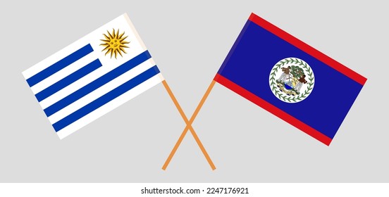 Crossed flags of Uruguay and Belize. Official colors. Correct proportion. Vector illustration
