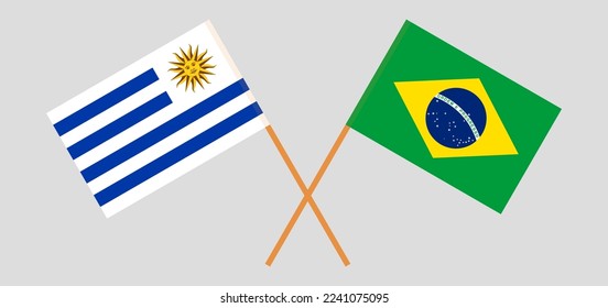 Crossed flags of Uruguay and Brazil. Official colors. Correct proportion. Vector illustration
