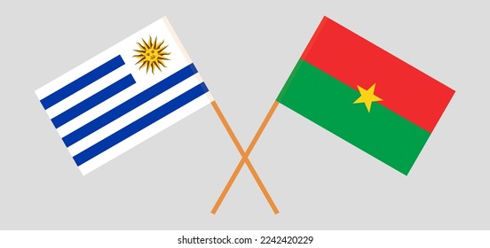 Überkreuzte Flaggen von Uruguay und Burkina Faso. Offizielle Farben. Richtiger Anteil. Vektorgrafik
