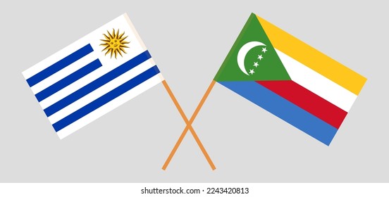 Crossed flags of Uruguay and the Comoros. Official colors. Correct proportion. Vector illustration
