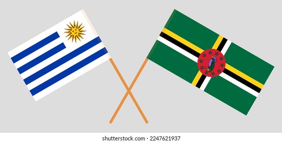 Crossed flags of Uruguay and Dominica. Official colors. Correct proportion. Vector illustration
