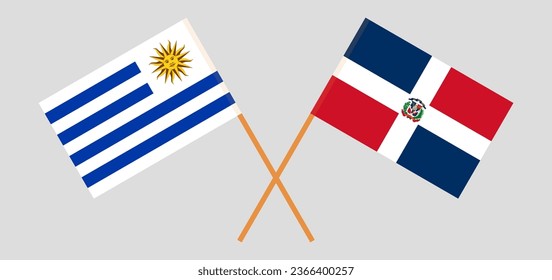 Crossed flags of Uruguay and Dominican Republic. Official colors. Correct proportion. Vector illustration
