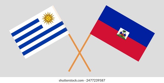 Crossed flags of Uruguay and Haiti. Official colors. Correct proportion. Vector illustration
