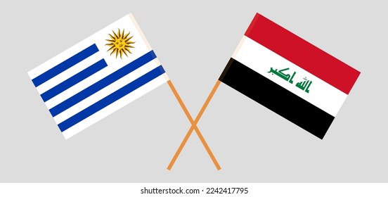 Crossed flags of Uruguay and Iraq. Official colors. Correct proportion. Vector illustration
