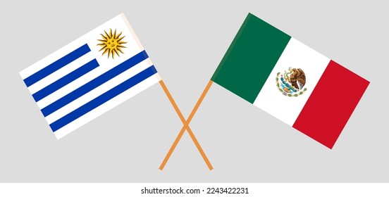 Crossed flags of Uruguay and Mexico. Official colors. Correct proportion. Vector illustration
