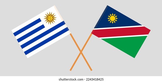 Crossed flags of Uruguay and Namibia. Official colors. Correct proportion. Vector illustration
