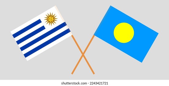 Crossed flags of Uruguay and Palau. Official colors. Correct proportion. Vector illustration
