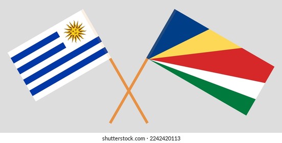 Crossed flags of Uruguay and Seychelles. Official colors. Correct proportion. Vector illustration
