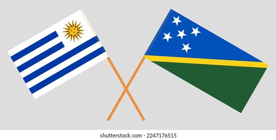 Crossed flags of Uruguay and Solomon Islands. Official colors. Correct proportion. Vector illustration
