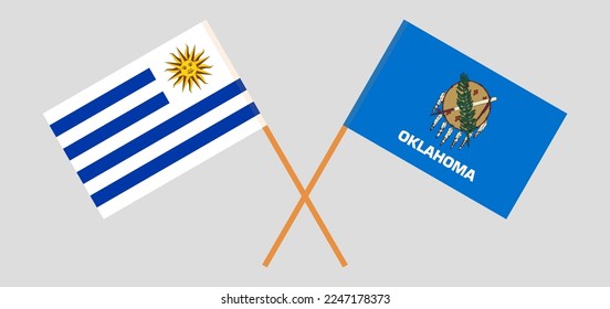 Banderas cruzadas de Uruguay y El estado de Oklahoma. Colores oficiales. Proporción correcta. Ilustración del vector
