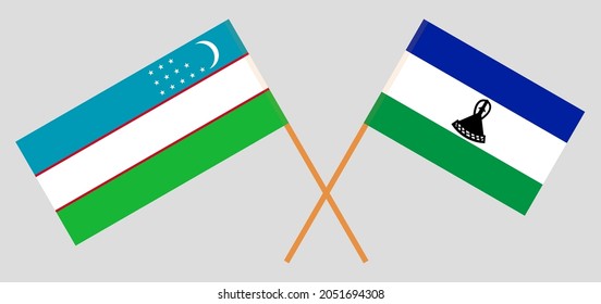 Crossed flags of Uzbekistan and Kingdom of Lesotho. Official colors. Correct proportion