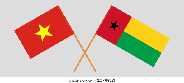 Crossed flags of Vietnam and Guinea-Bissau. Official colors. Correct proportion. Vector illustration
