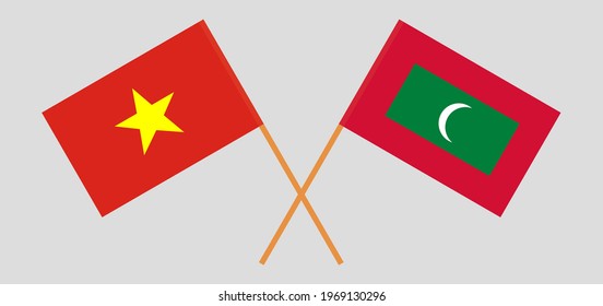 Crossed flags of Vietnam and Maldives. Official colors. Correct proportion