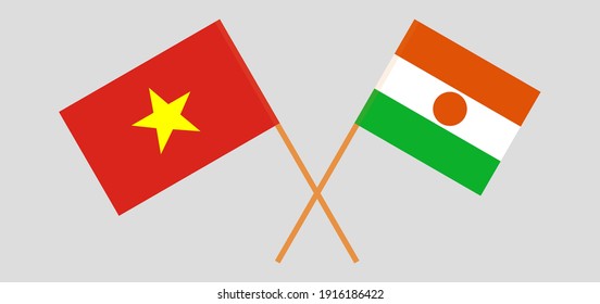 Crossed flags of Vietnam and the Niger
