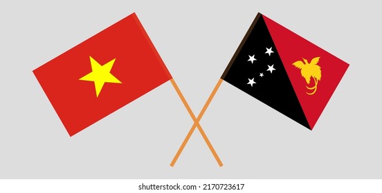 Crossed flags of Vietnam and Papua New Guinea. Official colors. Correct proportion. Vector illustration
