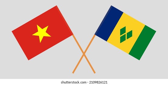 Crossed flags of Vietnam and Saint Vincent and the Grenadines. Official colors. Correct proportion. Vector illustration
