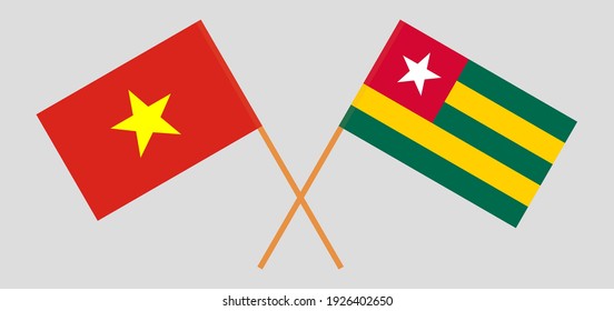 Crossed flags of Vietnam and Togo. Official colors. Correct proportion