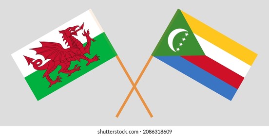 Crossed flags of Wales and the Comoros. Official colors. Correct proportion. Vector illustration
